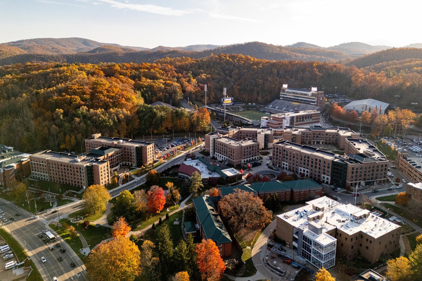 Aerial view of campus and stadium in the fall