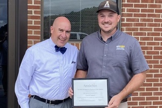 David Issacs and Executive Vice Chancellor JJ Brown with award